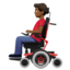 man in motorized wheelchair: medium-dark skin tone