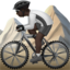 person mountain biking: dark skin tone