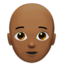 person: medium-dark skin tone, bald