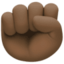 raised fist: dark skin tone