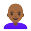 woman: medium-dark skin tone, bald