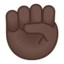 raised fist: dark skin tone